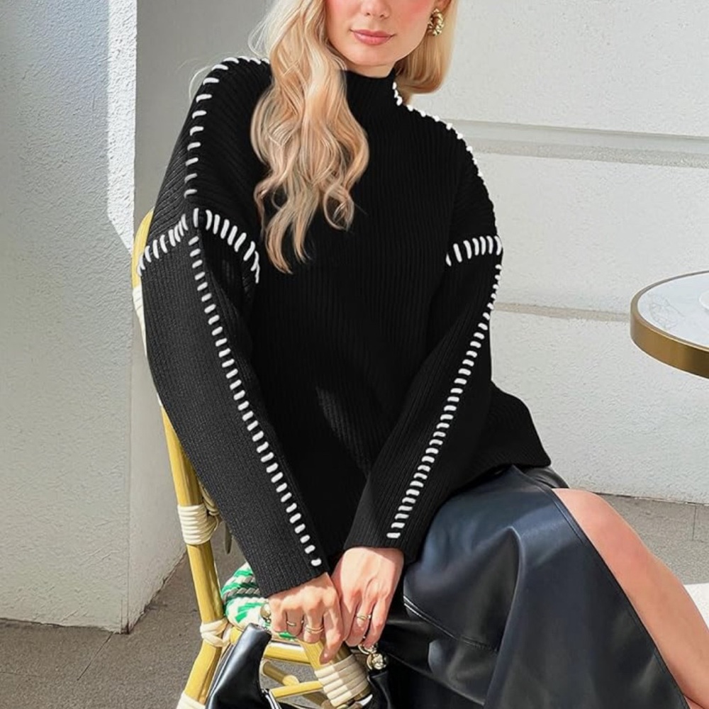 Black sweater with white stiches